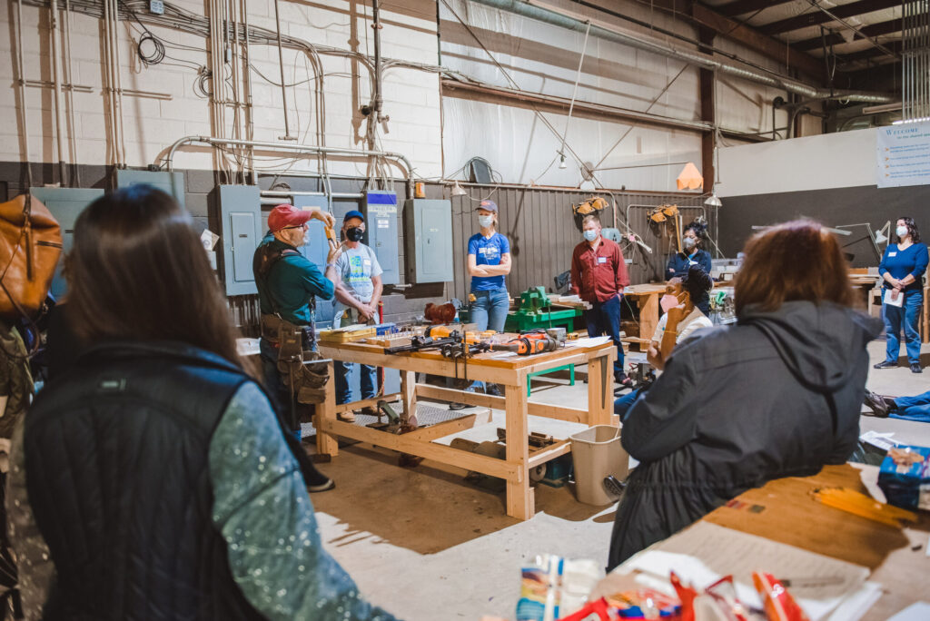 A gathering of Cville Tool Library members at a framing workshop