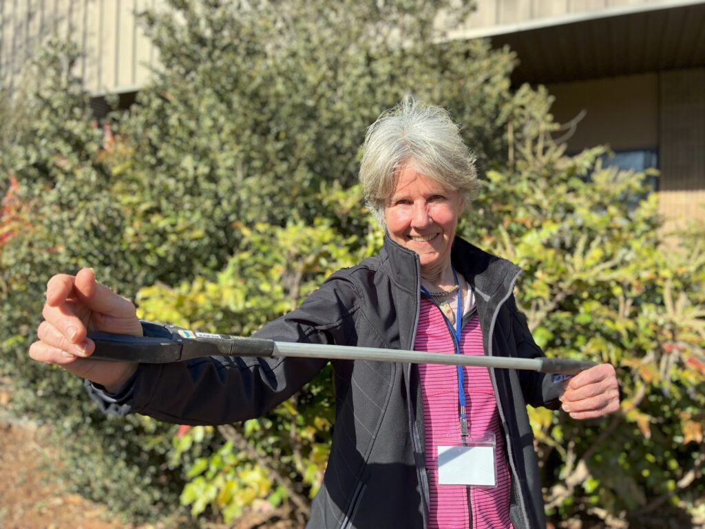 Tooligan Valerie holding a power washer